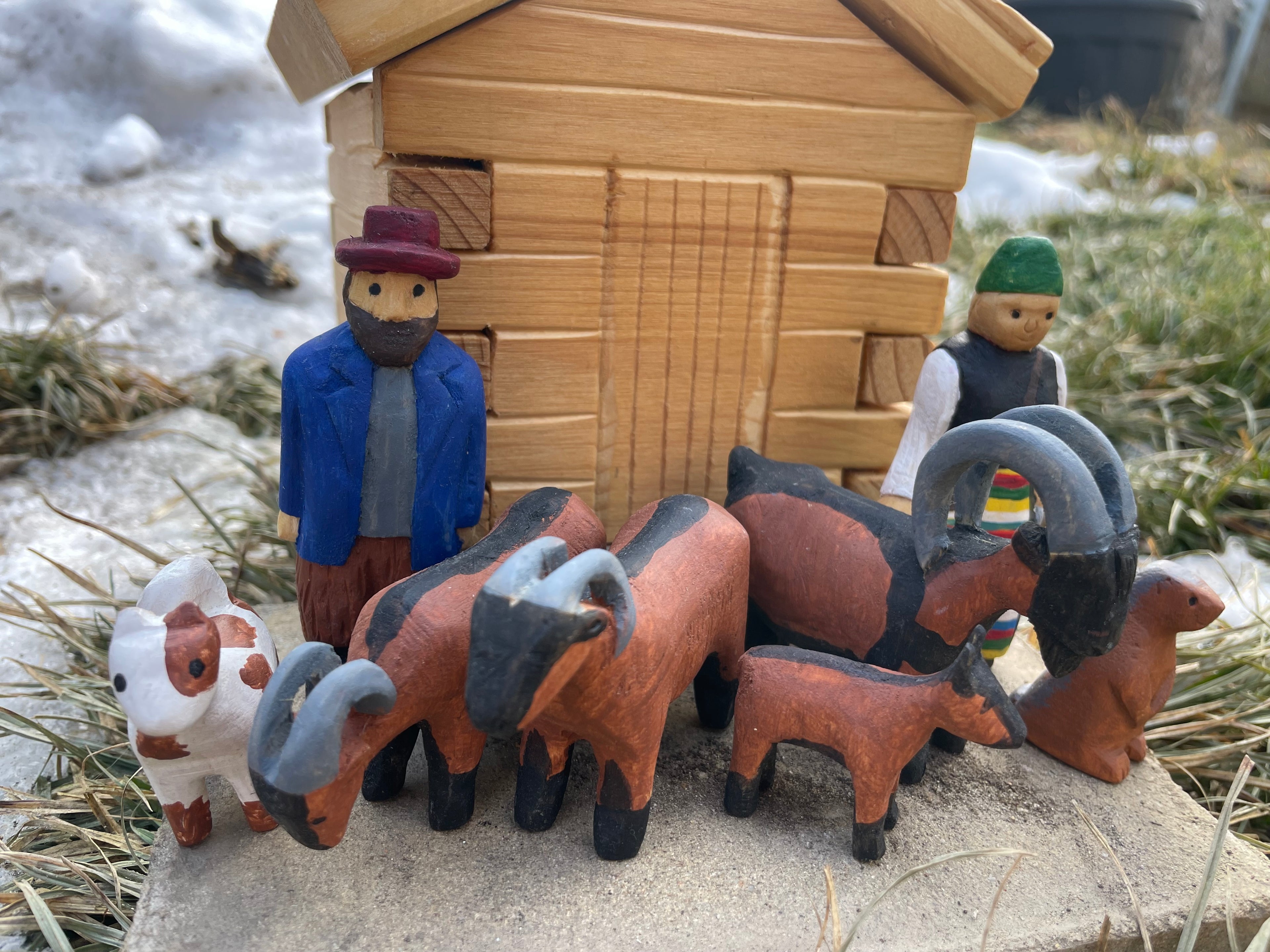 Alpine hut with shepherds and animals
